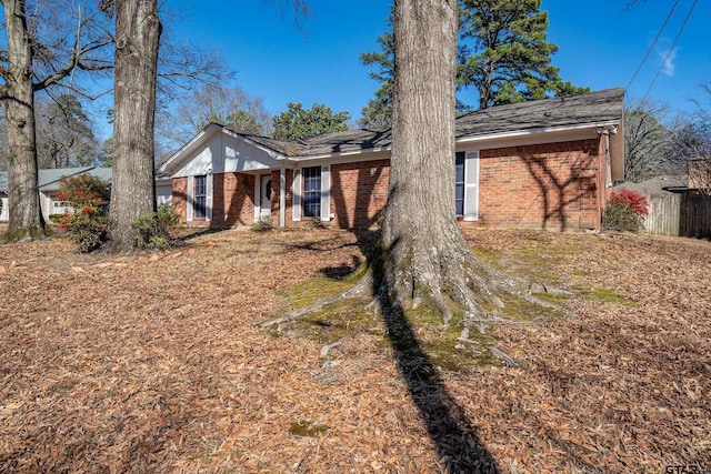 exterior space with brick siding