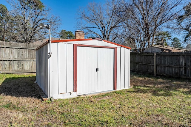 view of shed featuring a fenced backyard