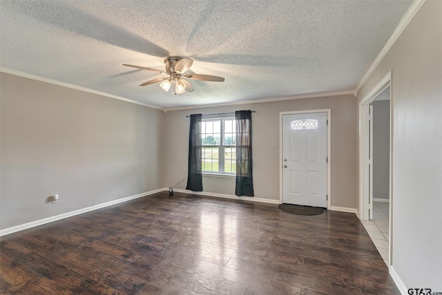 foyer featuring a textured ceiling, dark hardwood / wood-style flooring, ceiling fan, and crown molding