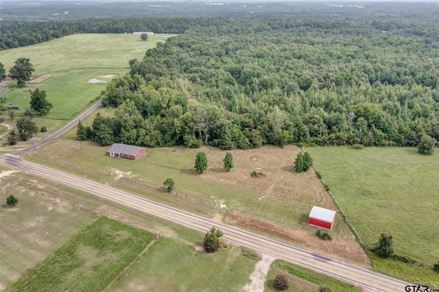 birds eye view of property with a rural view