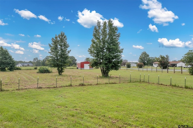 view of yard with a rural view