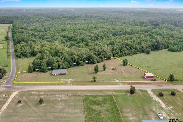 birds eye view of property with a rural view