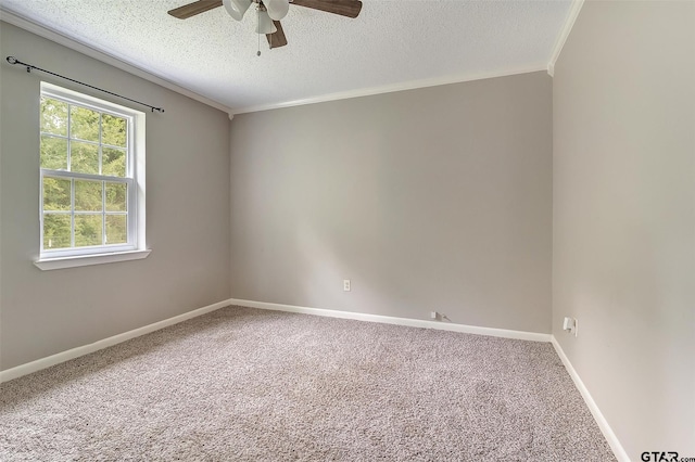 empty room featuring carpet flooring, ceiling fan, a textured ceiling, and ornamental molding