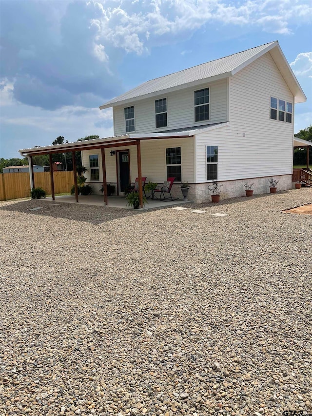 rear view of house featuring a patio