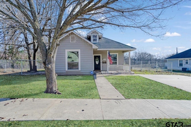 bungalow-style home featuring a porch and a front lawn