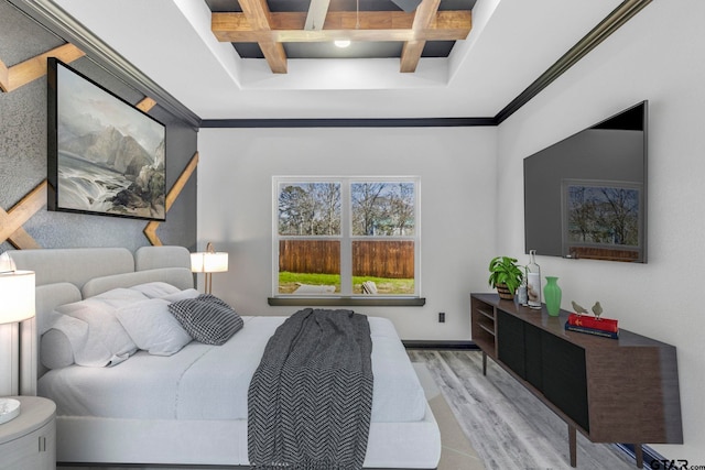 bedroom featuring beam ceiling, coffered ceiling, and light wood finished floors