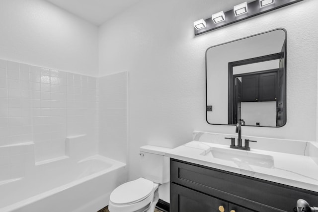 bathroom with washtub / shower combination, toilet, and vanity