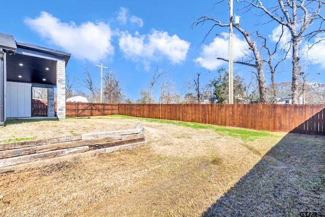 view of yard featuring a fenced backyard