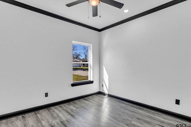 unfurnished room with ceiling fan, crown molding, baseboards, and wood finished floors