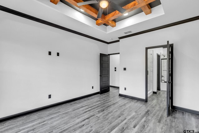 unfurnished bedroom featuring baseboards, visible vents, coffered ceiling, light wood-style flooring, and crown molding