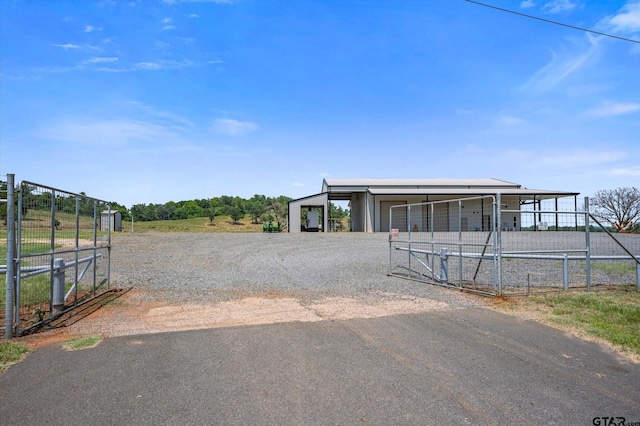 exterior space with an outbuilding and a garage