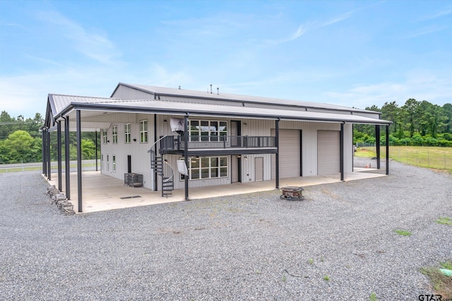 view of front facade with a garage and a carport