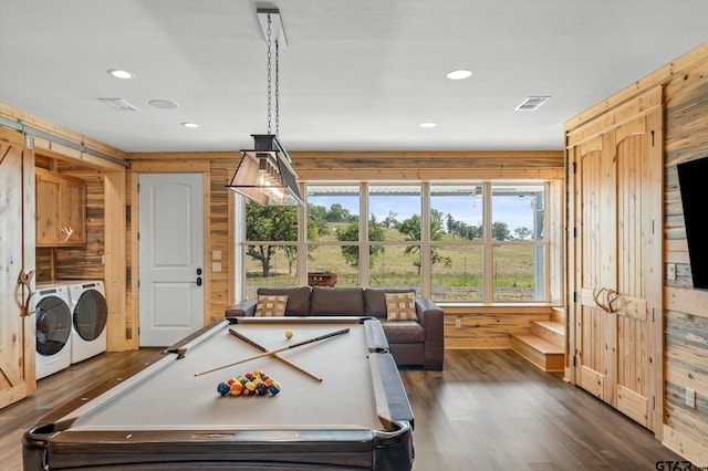 playroom featuring washing machine and clothes dryer, wooden walls, dark wood-type flooring, and billiards