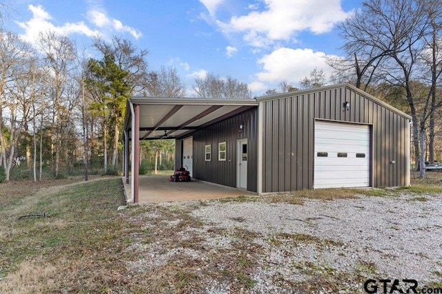 garage featuring a carport