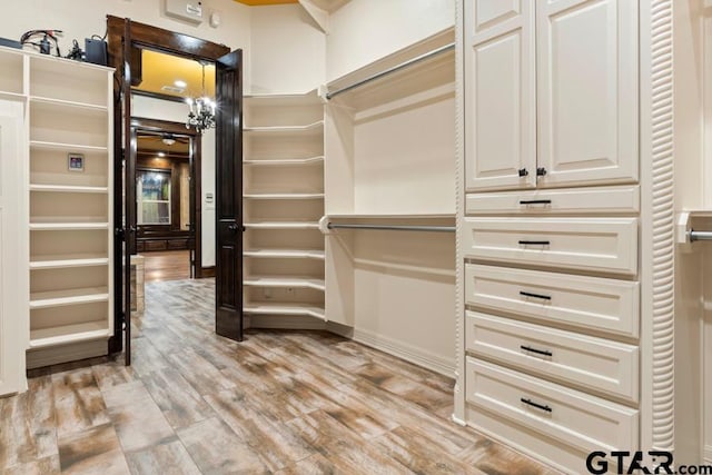 walk in closet featuring light wood-type flooring