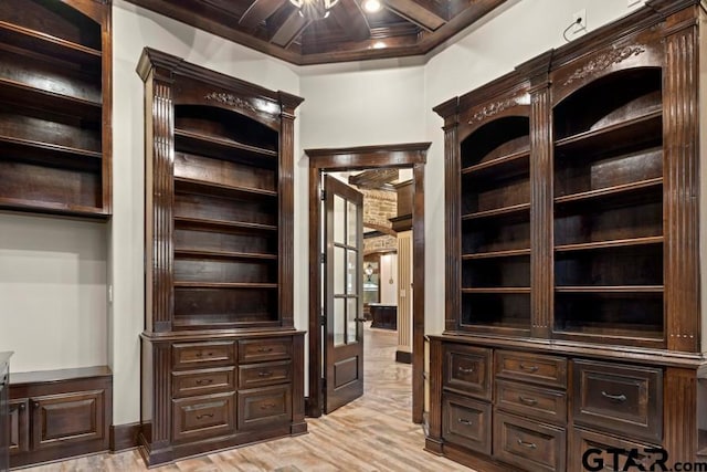 interior space featuring light hardwood / wood-style flooring, beamed ceiling, ceiling fan, and coffered ceiling