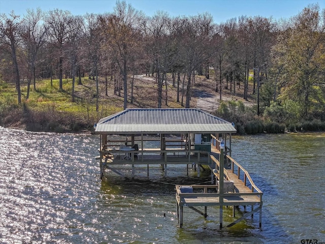 dock area featuring a water view and boat lift