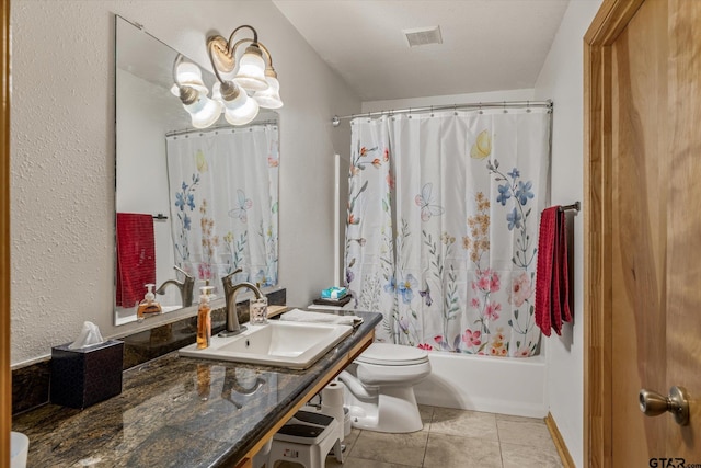 full bath with a notable chandelier, toilet, shower / bath combo, tile patterned flooring, and vanity