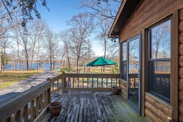 wooden deck with a water view