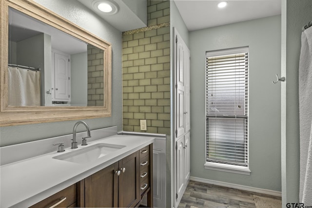 bathroom featuring hardwood / wood-style floors and vanity