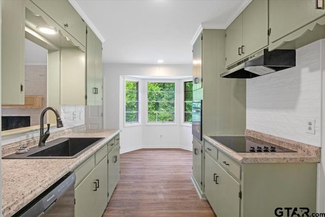 kitchen featuring light countertops, under cabinet range hood, a sink, dark wood finished floors, and black appliances