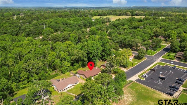 aerial view featuring a view of trees