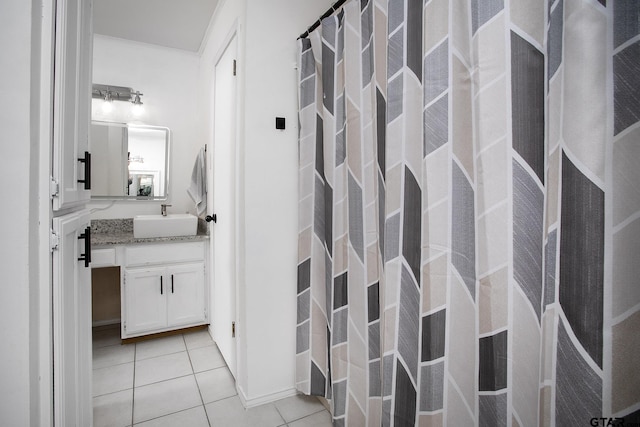 bathroom with tile patterned floors, vanity, and curtained shower