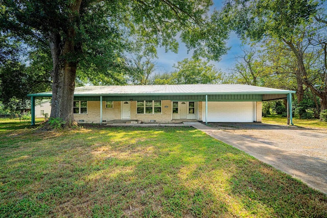 single story home featuring a porch, a carport, a front lawn, and a garage