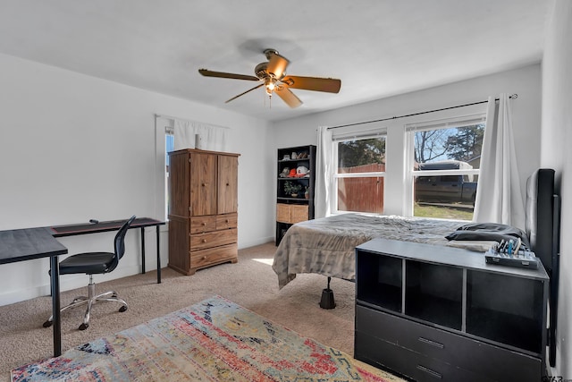 bedroom with baseboards, carpet, and a ceiling fan