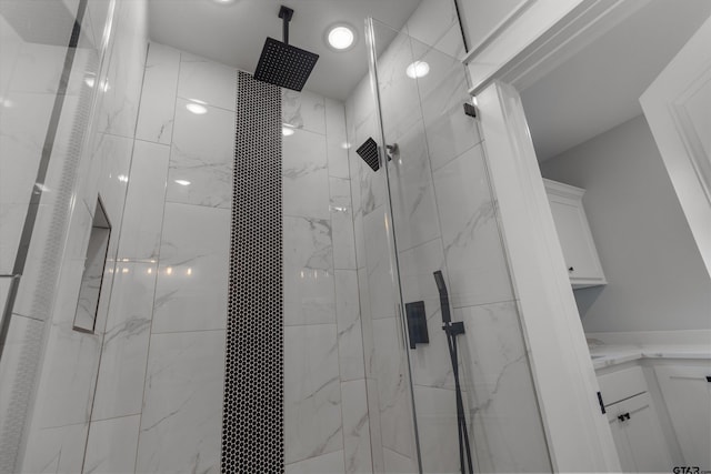 bathroom with a tile shower