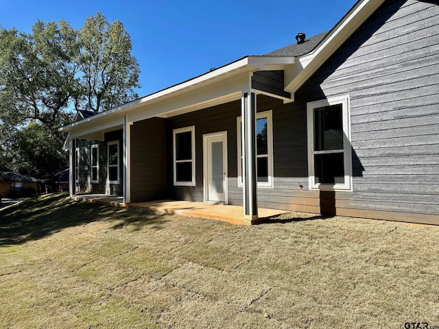 view of home's exterior with a yard