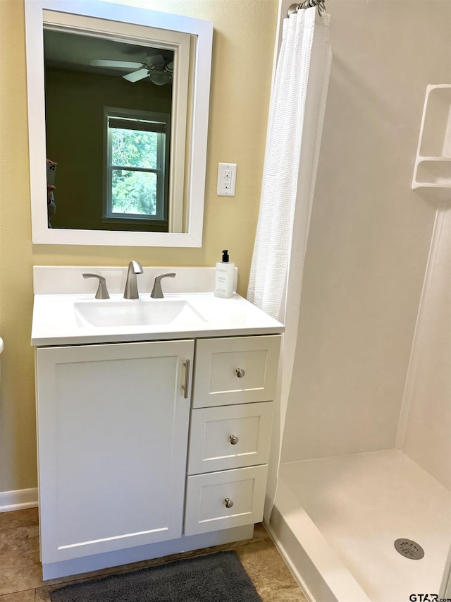 828 Adams St, Jacksonville, TX 75766 - full bath featuring a shower with shower curtain, vanity, a ceiling fan, and tile patterned flooring
