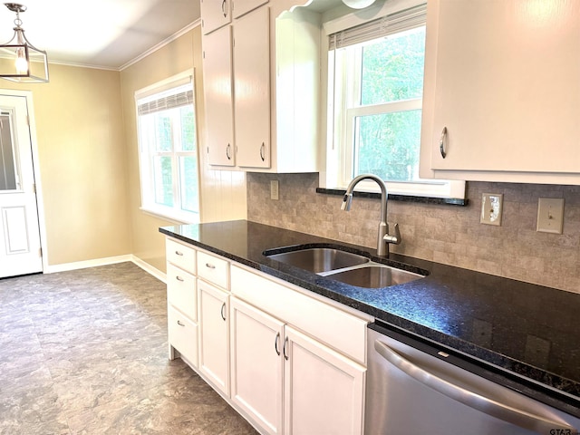 828 Adams St, Jacksonville, TX 75766 - kitchen featuring stainless steel dishwasher, a sink, crown molding, decorative backsplash, and white cabinetry