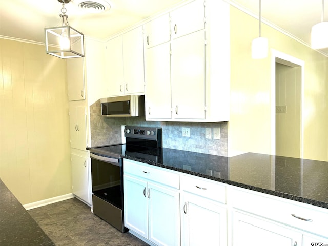 828 Adams St, Jacksonville, TX 75766 - kitchen with stainless steel appliances, white cabinets, decorative backsplash, ornamental molding, and dark stone countertops