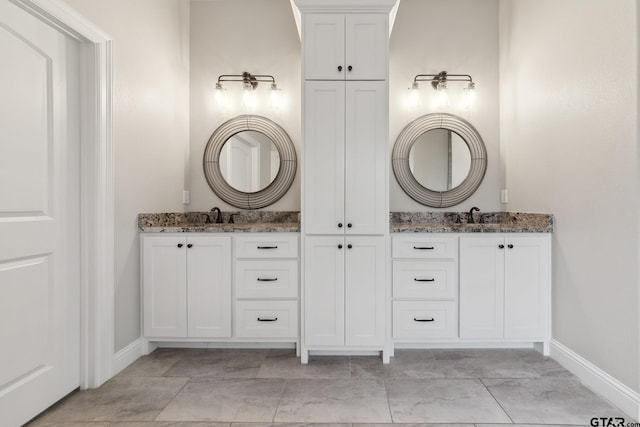 261 Heritage Way, Bullard, TX 75757 - bathroom featuring baseboards and vanity