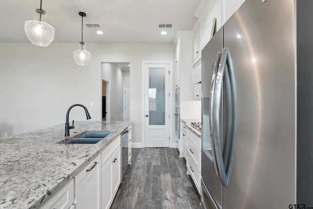 261 Heritage Way, Bullard, TX 75757 - kitchen with appliances with stainless steel finishes, a sink, white cabinetry, dark wood-style floors, and recessed lighting