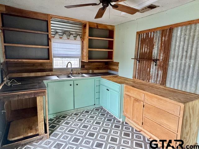 kitchen with ceiling fan and sink