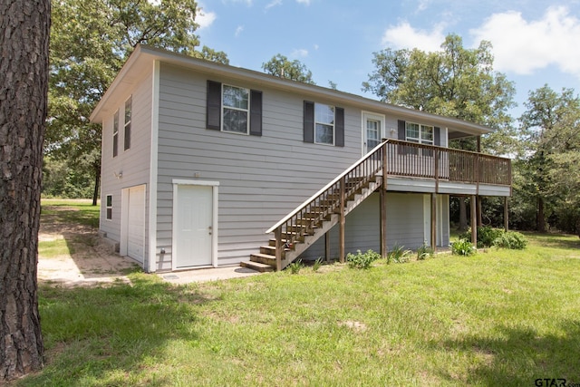 1225 S Fm 1002, Big Sandy, TX 75755 - back of property featuring stairs, a wooden deck, an attached garage, and a lawn