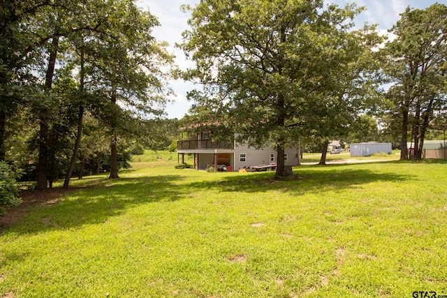1225 S Fm 1002, Big Sandy, TX 75755 - view of green lawn with a wooden deck