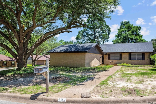 view of front of home featuring brick siding