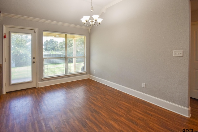 unfurnished dining area with a wealth of natural light, a chandelier, crown molding, and dark hardwood / wood-style flooring