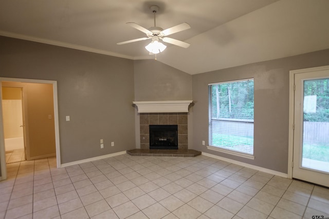 unfurnished living room featuring ceiling fan, light tile patterned floors, a healthy amount of sunlight, and lofted ceiling