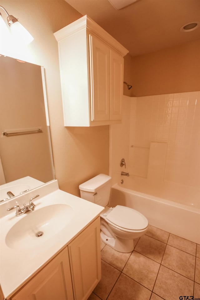 full bathroom with shower / bath combination, toilet, vanity, and tile patterned flooring