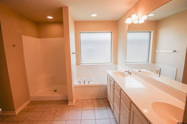 bathroom with vanity, tile patterned floors, and plus walk in shower