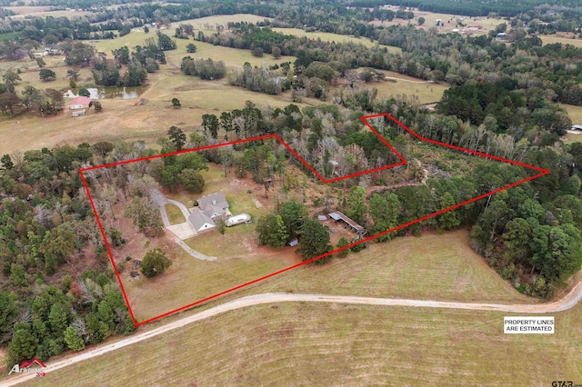 birds eye view of property featuring a rural view