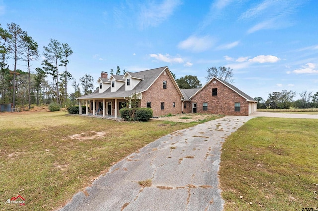 cape cod house with a porch and a front lawn