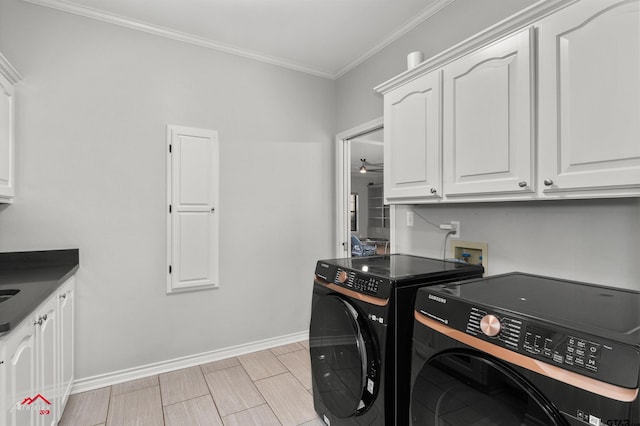 laundry room with cabinets, separate washer and dryer, ceiling fan, and ornamental molding