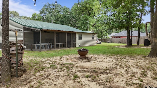 326 Ella Ln, Bullard, TX 75757 - view of yard with a sunroom and a fire pit