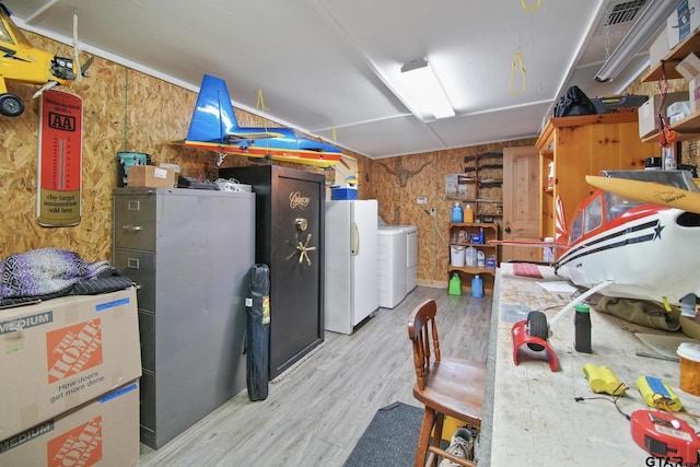 326 Ella Ln, Bullard, TX 75757 - finished below grade area featuring freestanding refrigerator, wood finished floors, wood walls, and separate washer and dryer