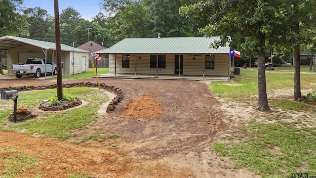 326 Ella Ln, Bullard, TX 75757 - view of front of home featuring a front yard, a porch, driveway, and metal roof